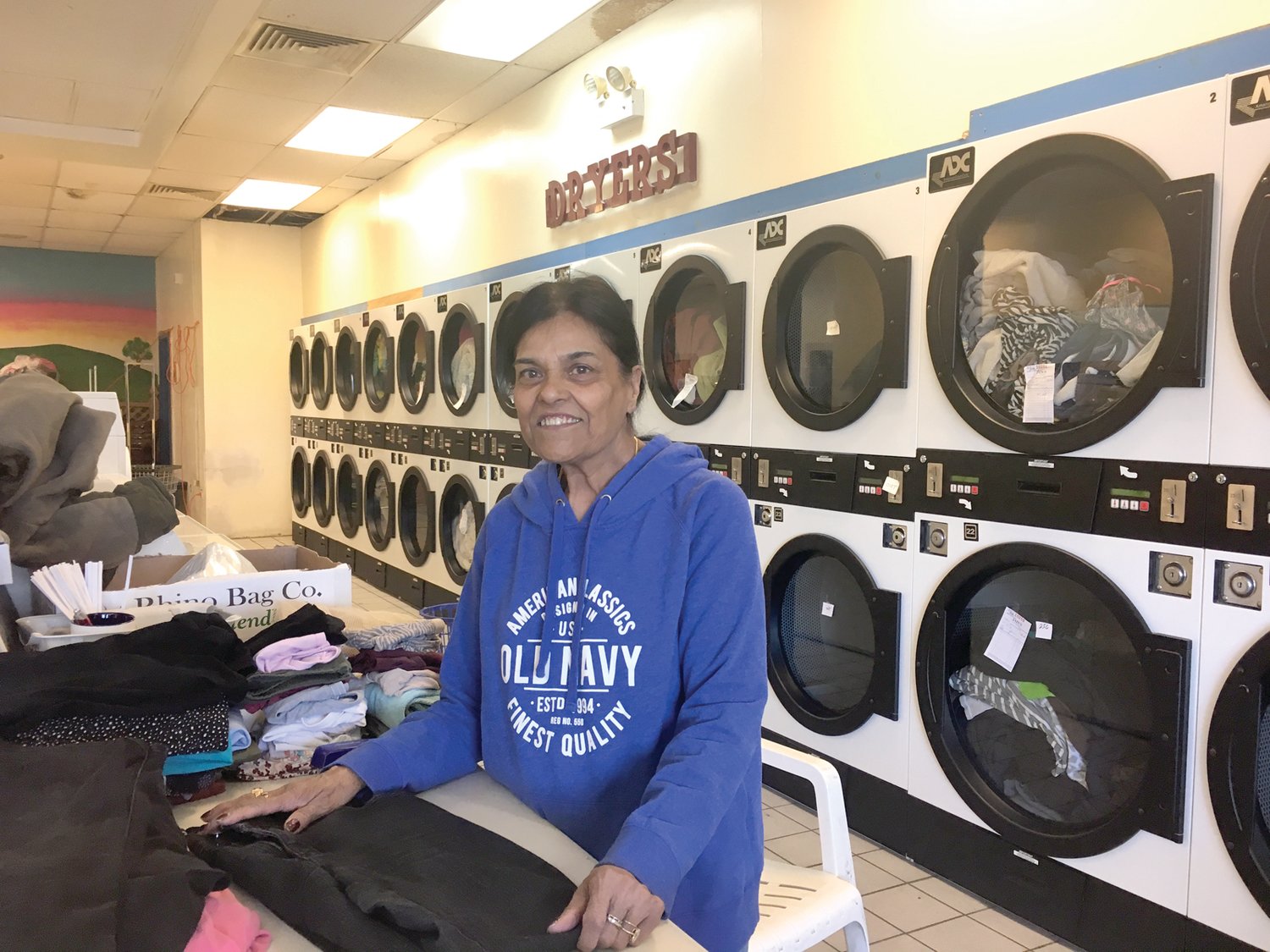 Kaushal Jain is a steady and familiar face at Jain’s Laundry, the family-owned business that she and her husband Sripal have operated for over twenty-nine years